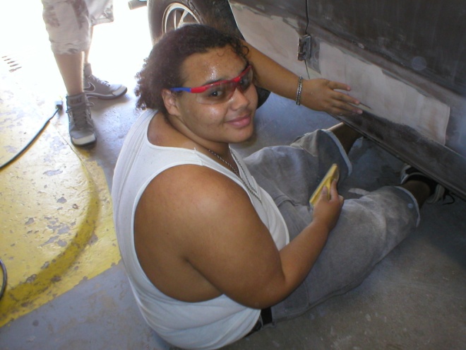 Fin Man Stokes repairing the damage on the right body side of the Ford van. (Always smiling).