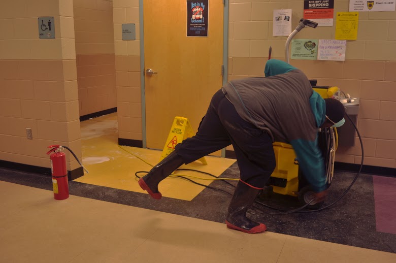 Faculty worked to efficiently clean the effects of a fire that was set inside of a trashcan in Renegade.