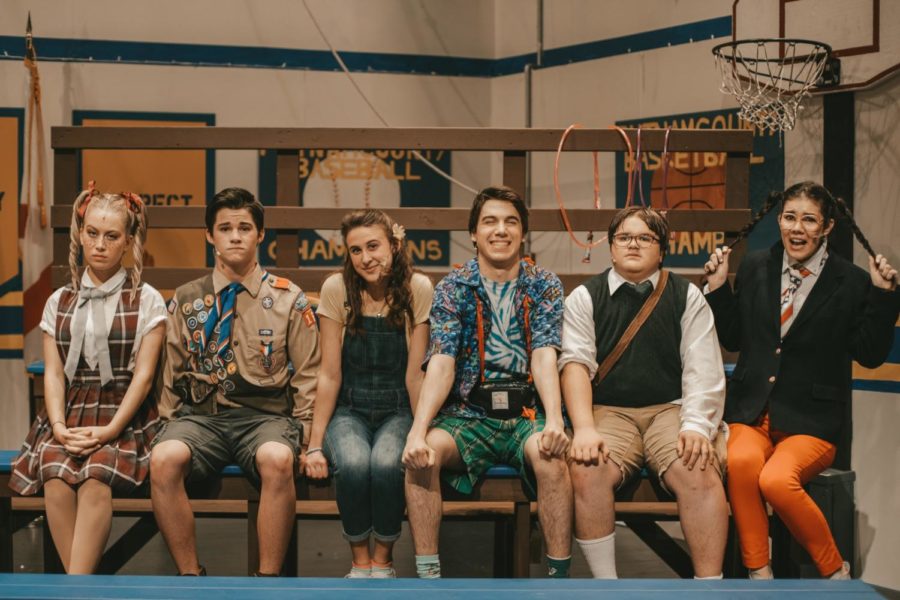 The main characters of the 25th Annual Putnam County Spelling Bee line up on the stage.