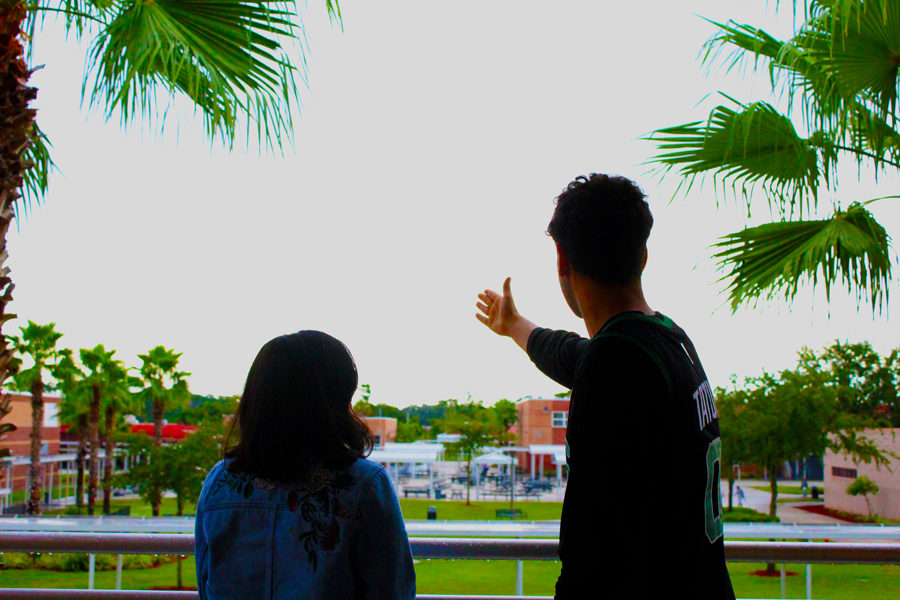 A senior talks with a freshmen and shows her the great views of Seminole High School.

