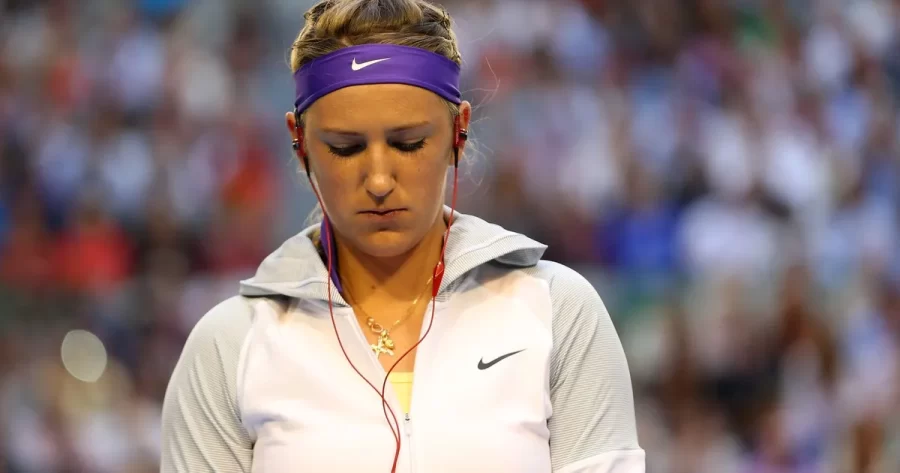 A professional tennis player is getting hyped for her game. 