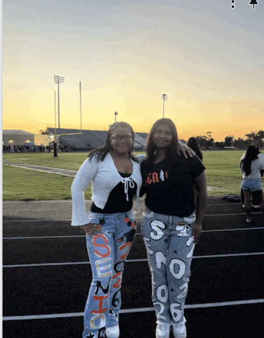 Evalise Trussell and Prisni Nawala start off their final year enjoying the early morning sunset on the Football field. 