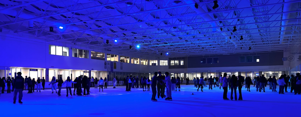 The ice rink is filled with IB students enjoying their time skating and hanging out with their friends.
