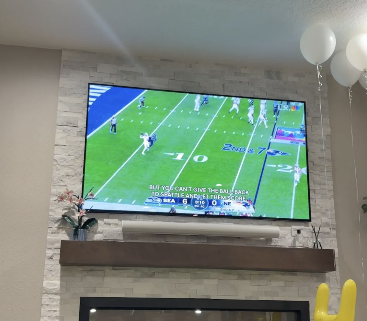 TV screen playing the second quarter of the game live; the score is 6-0 with 3:10 left in the quarter.
