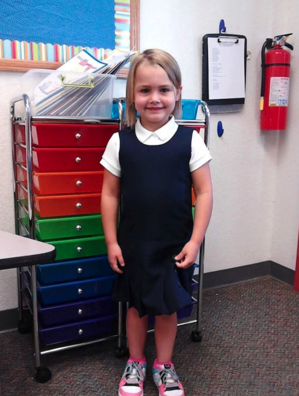  Shannon Lee, a Seminole high school senior at her elementary school with classroom items. 
